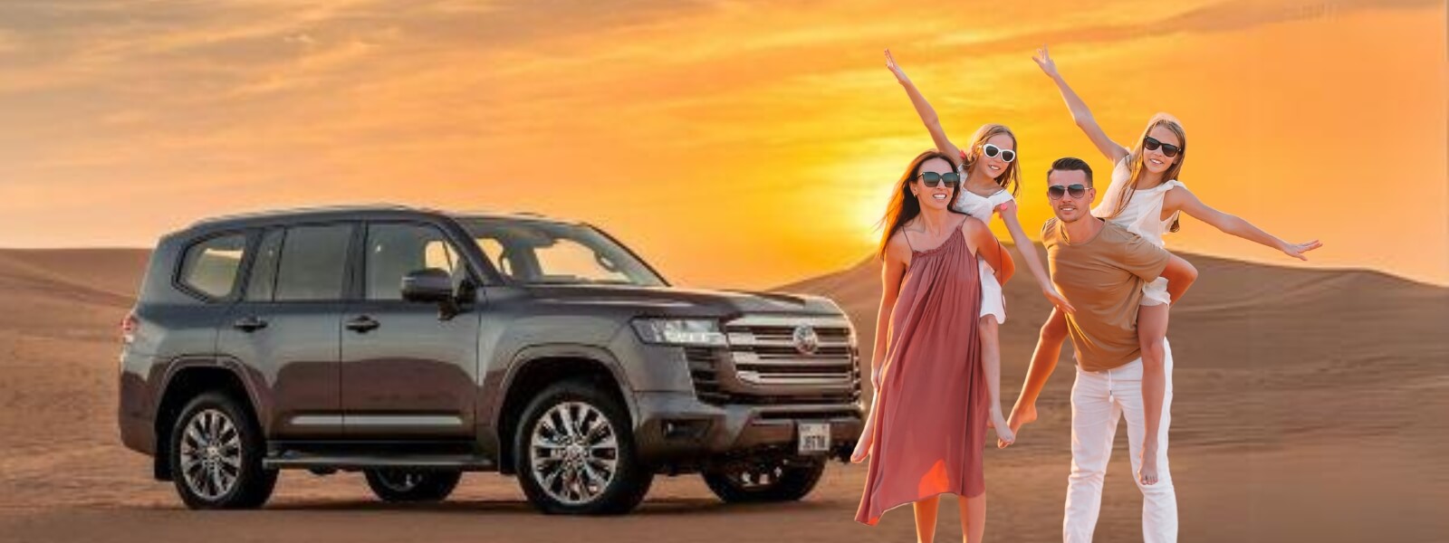 A family of four standing in front of a SUV in the desert, with sand dunes in the background.